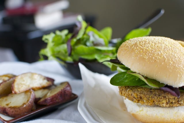 Namely_Marly_Bean_Burgers2 A delicious vegan burger made with black beans and chickpeas is served with potato wedges and a salad.