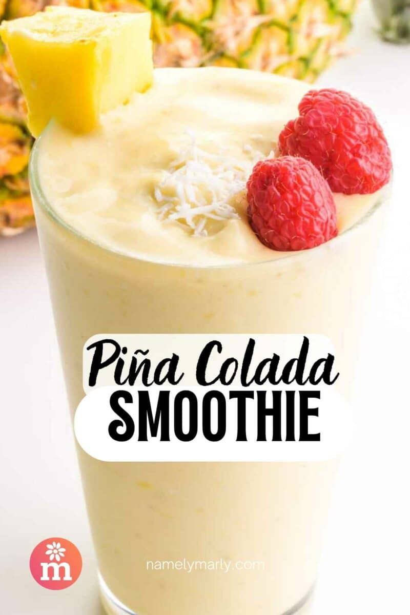 A tall glass has a creamy smoothie with fruit on top. The text reads, Pina Colada Smoothie.