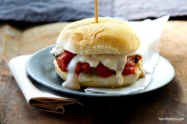 Vegan Chicken Parmesan Sandwich with a white sauce drizzling down the sides