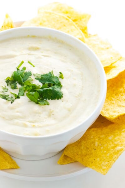 Vegan Cheese Dip is surrounded by tortilla chips and ready to serve