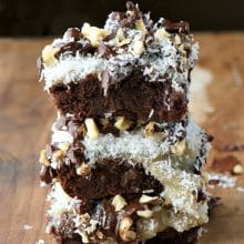 Coconut Brownies are stacked three high!