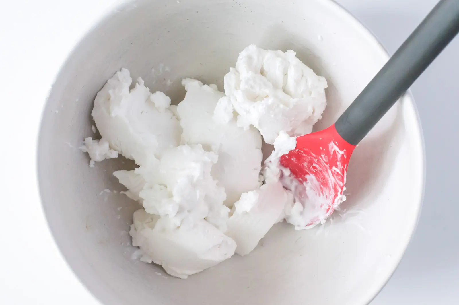 How to Make Vegan Coconut Whipped Cream: Add the creamy, firm coconut milk to a chilled bowl