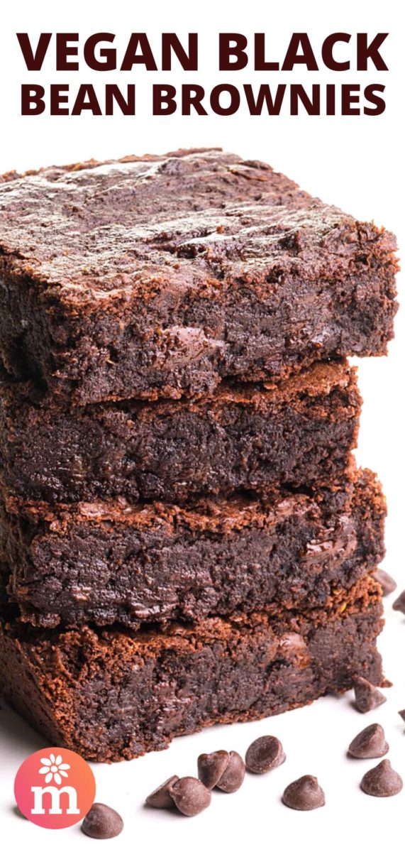 A stack of four brownies shows melted chocolate chips and there are more chocolate chips on the table beside them. The text on the image reads, Vegan Black Bean Brownies.