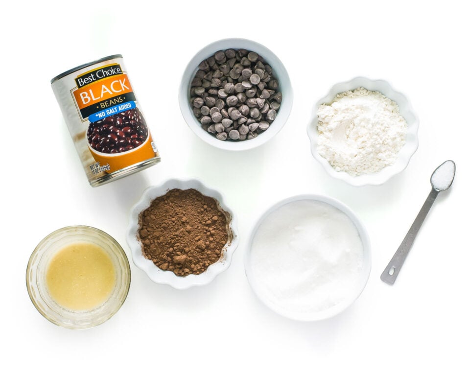 Ingredients to make vegan black bean brownies on a white counter top.