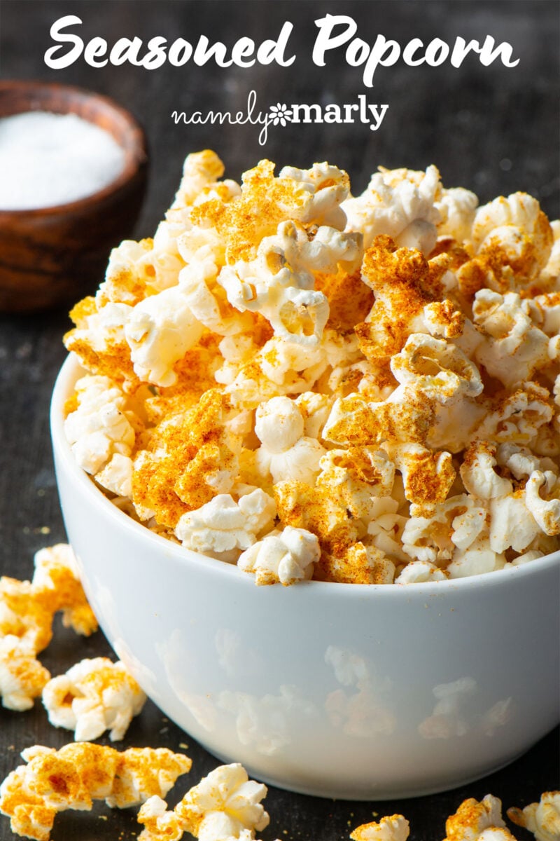 Seasoned popcorn in a bowl with text that says, Seasoned Popcorn