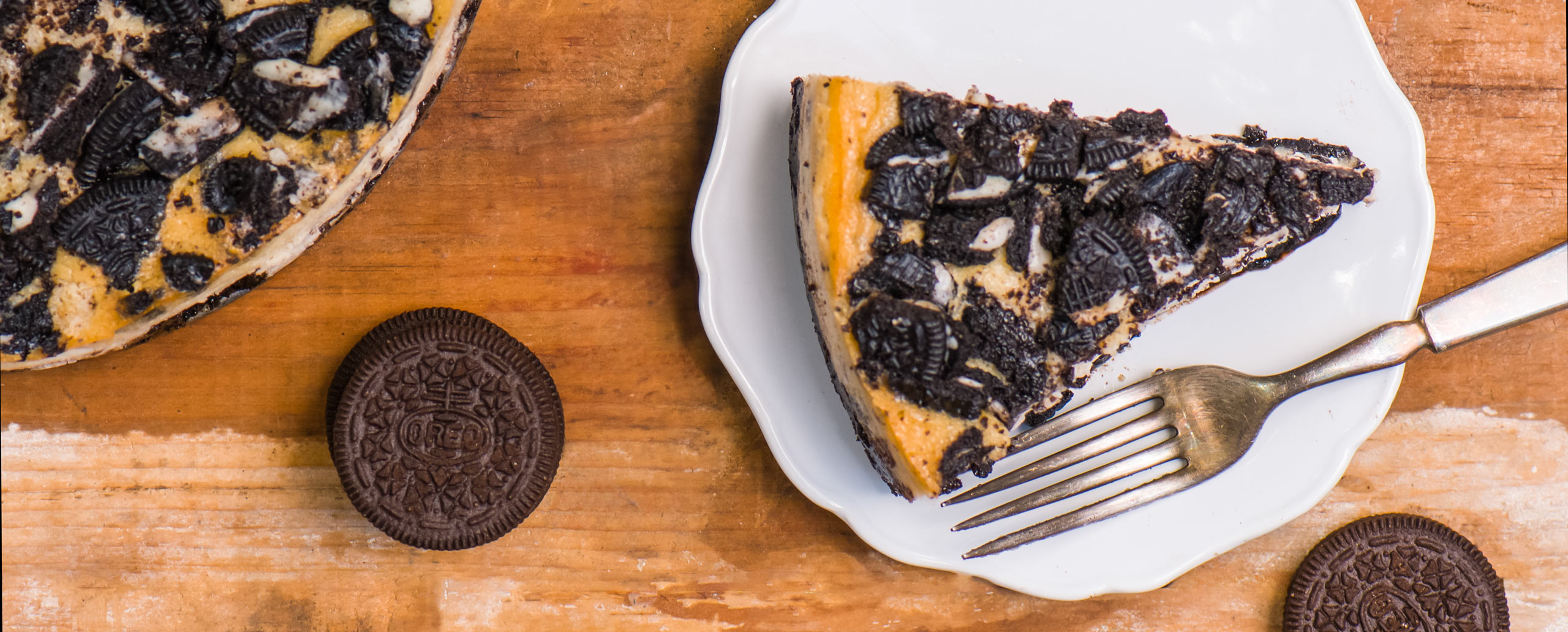 Overhead view of Oreo Cheesecake on a white plate
