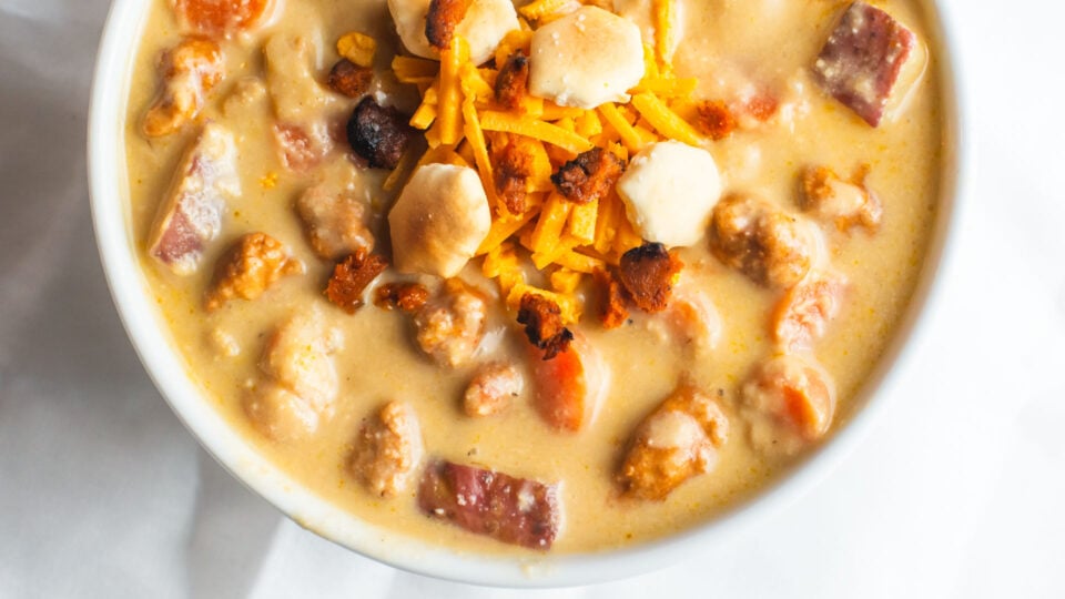 Looking down on a bowl of vegan cheesy soup.