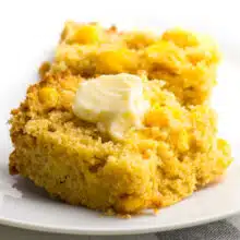 Delicious vegan cornbread is topped with melted vegan butter!