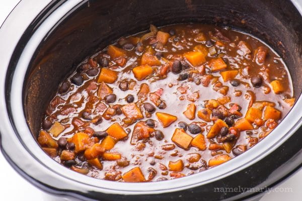A crockpot is full of sweet potato chili, ready to be served into bowls!