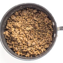 Cooked lentils in a saucepan.