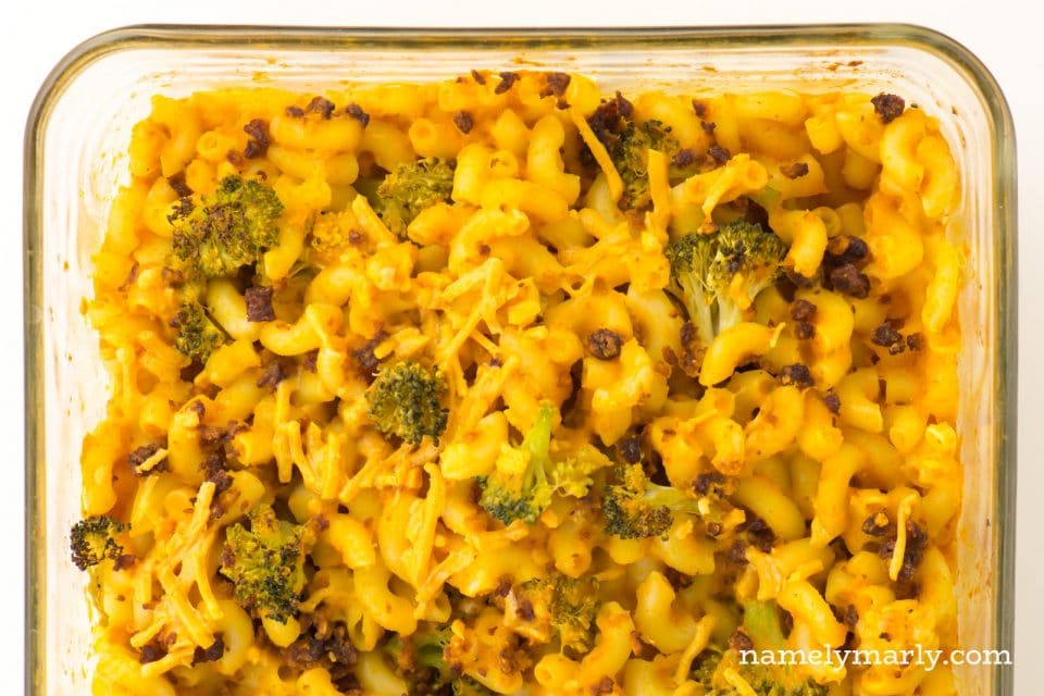 Vegan Mac and Cheese with broccoli and veggie crumbles in a casserole dish.