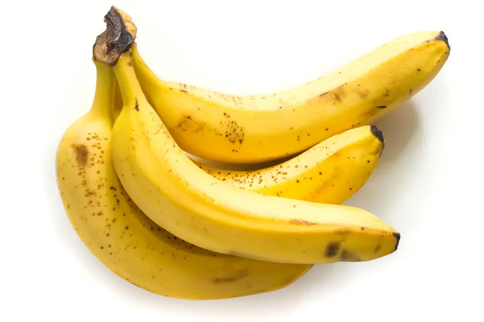 Bananas on a white counter top.