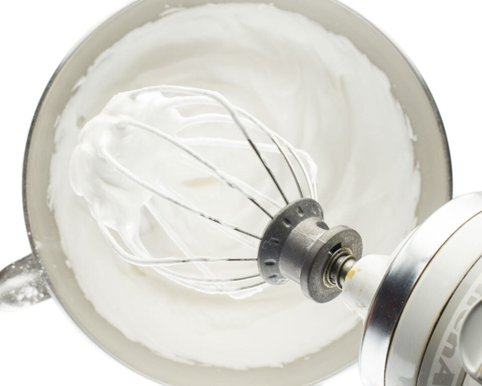 A mixing bowl shows how fluffy vegan meringue can be.