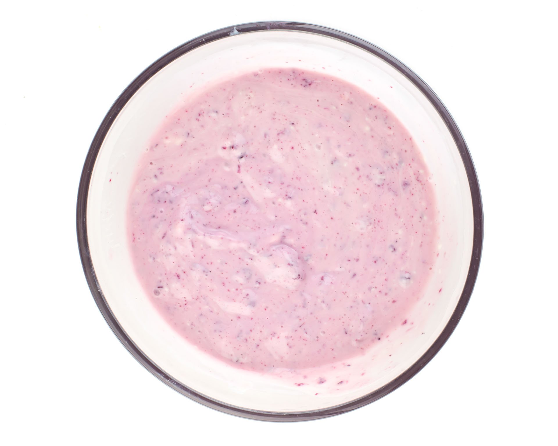 A pink hued sauce in a glass bow.