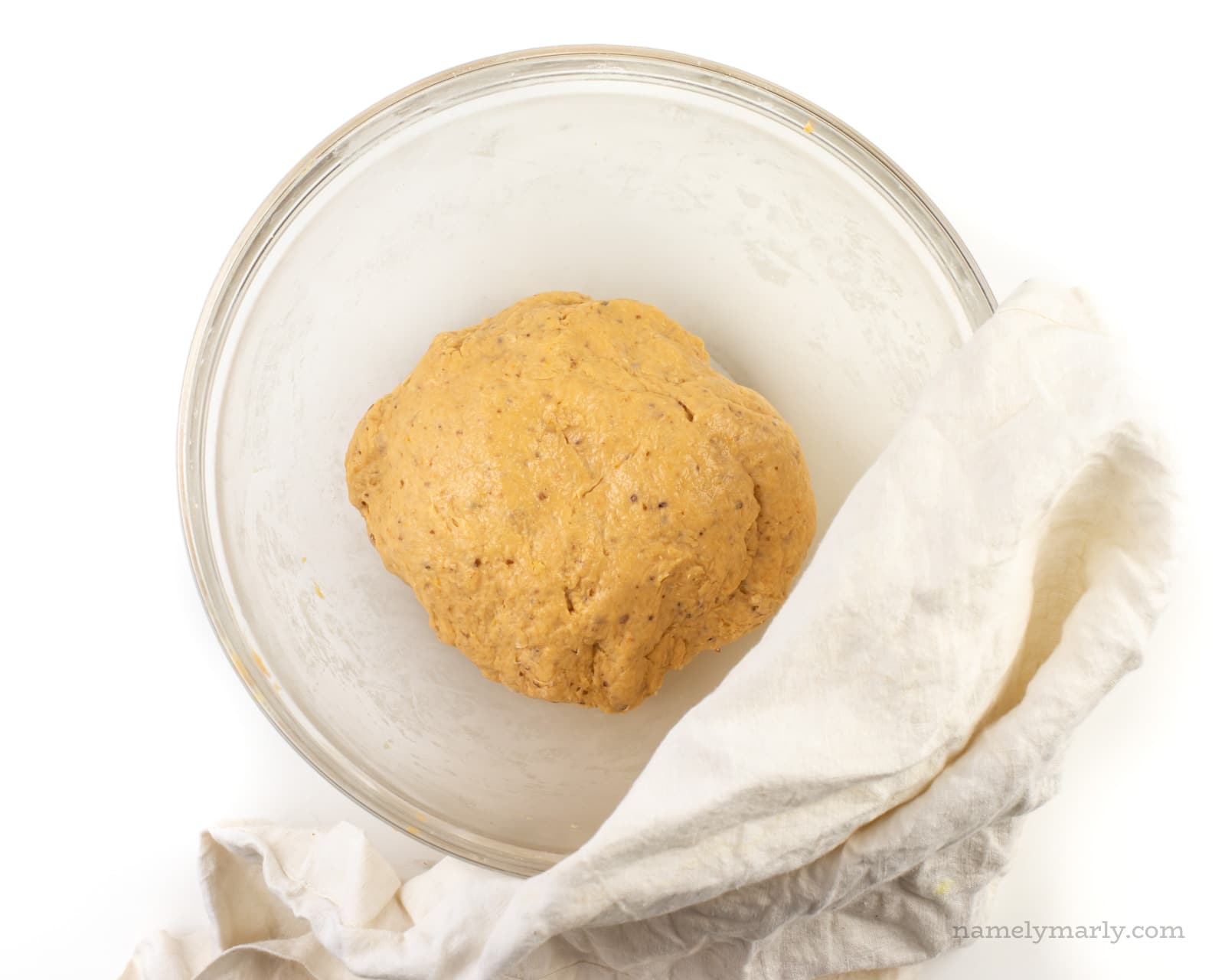 Sweet potato dough is placed in a bowl to rise.