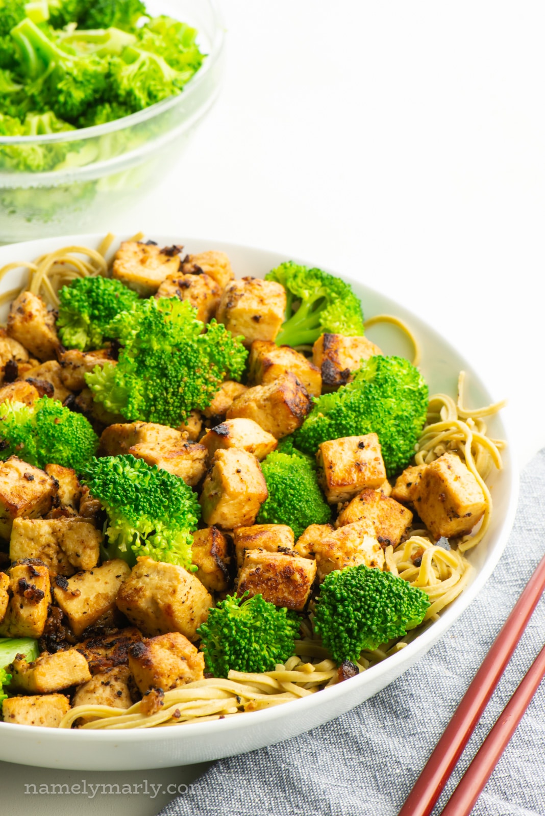 A rice bowl of miso tofu with steamed broccoli.