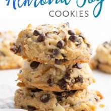 A stack of cookies with more cookies around it and the text above it reads: Almond Joy Cookies