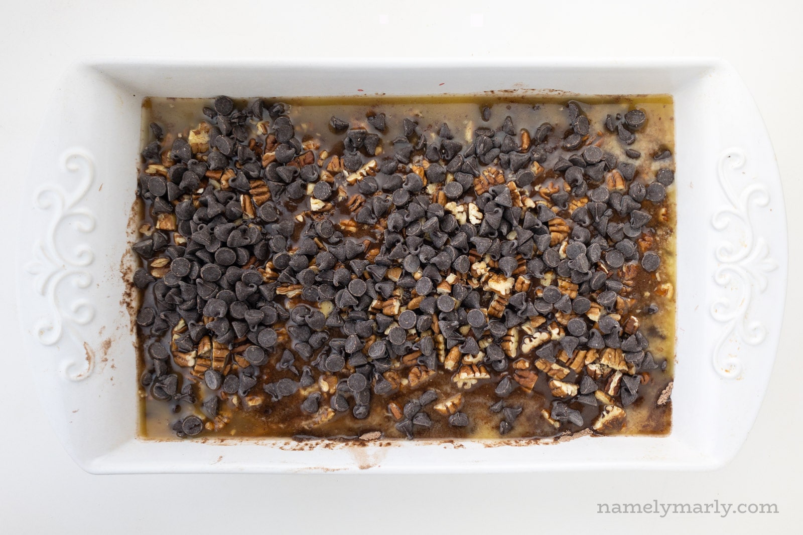 Chocolate chips have been added to this unbaked chocolate dump cake.
