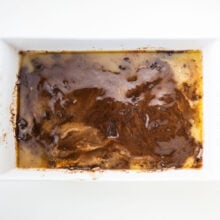 Looking down on cake mix that's been topped with butter.