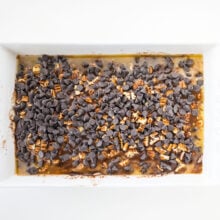 Chocolate chips have been added to this unbaked chocolate dump cake.