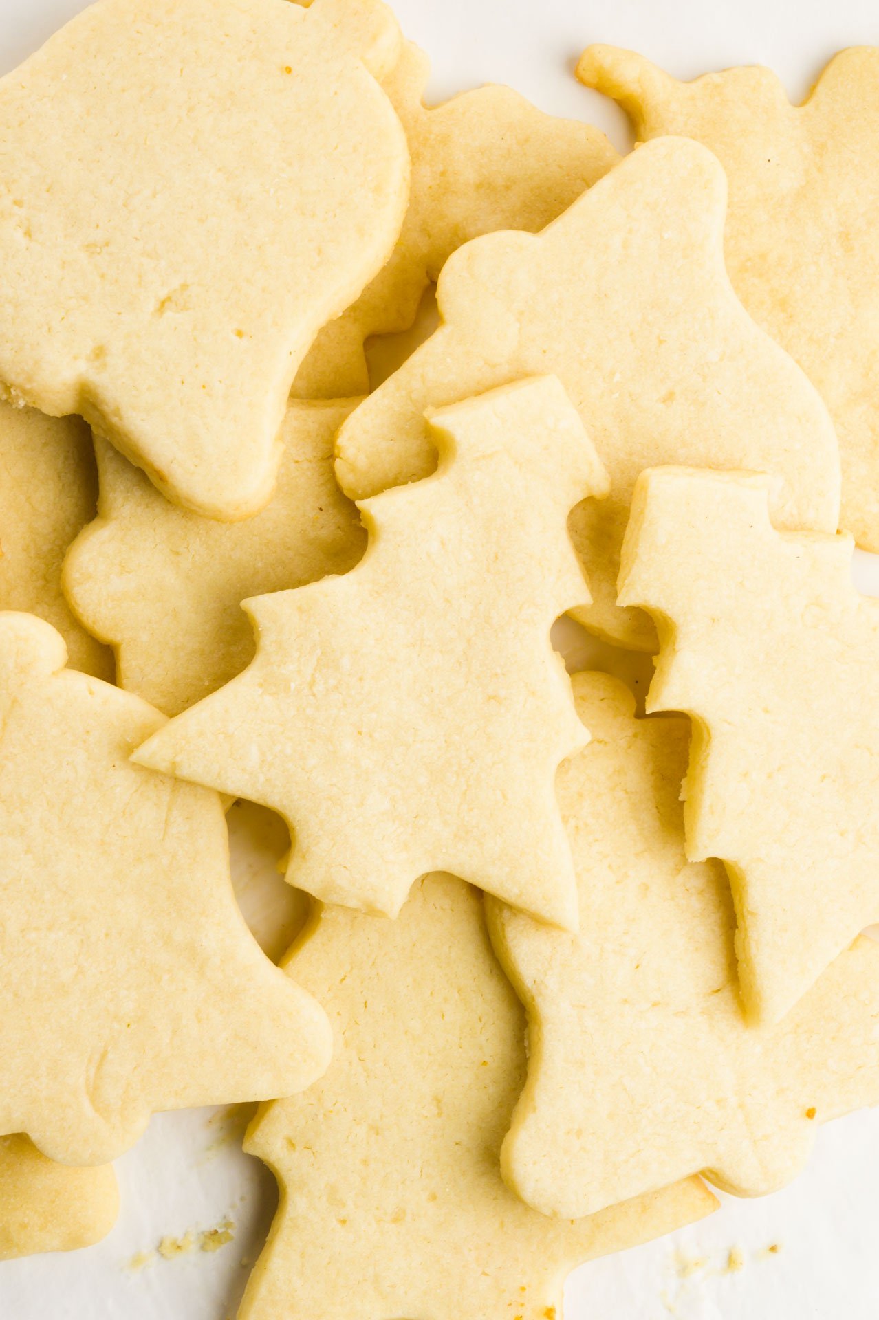 Several unfrosted sugar cookies are sitting in a stack.