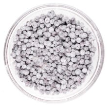 A bowl of blueberries has been coated with a flour mixture.