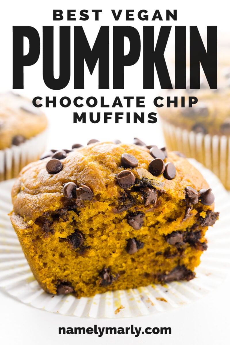 Cut vegan pumpkin muffin with chocolate chips, placed on a white baking cup, with another muffin blurred in the background.