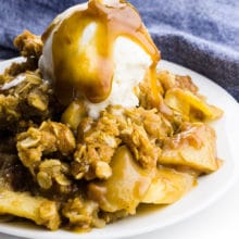 A photo of apple crisp with ice cream on top and caramel being drizzled has this text at the bottom: Best Vegan Apple Crisp.