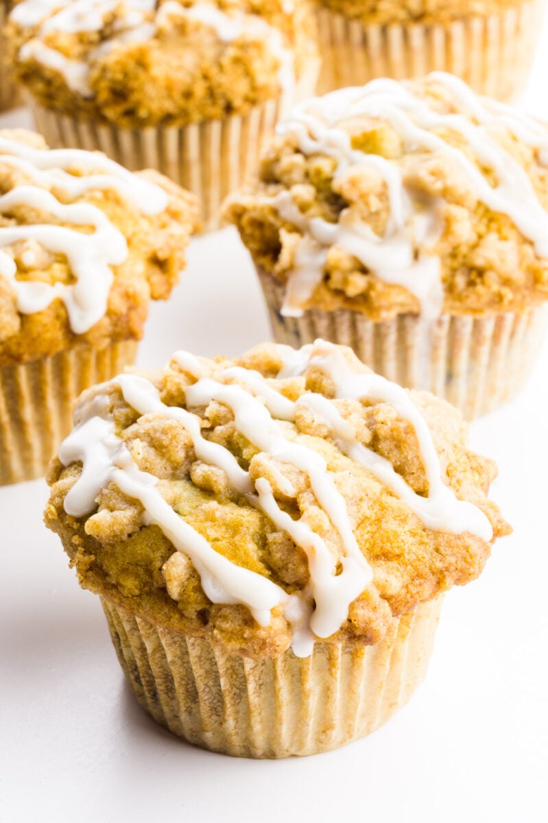 Several cinnamon muffins are grouped together.
