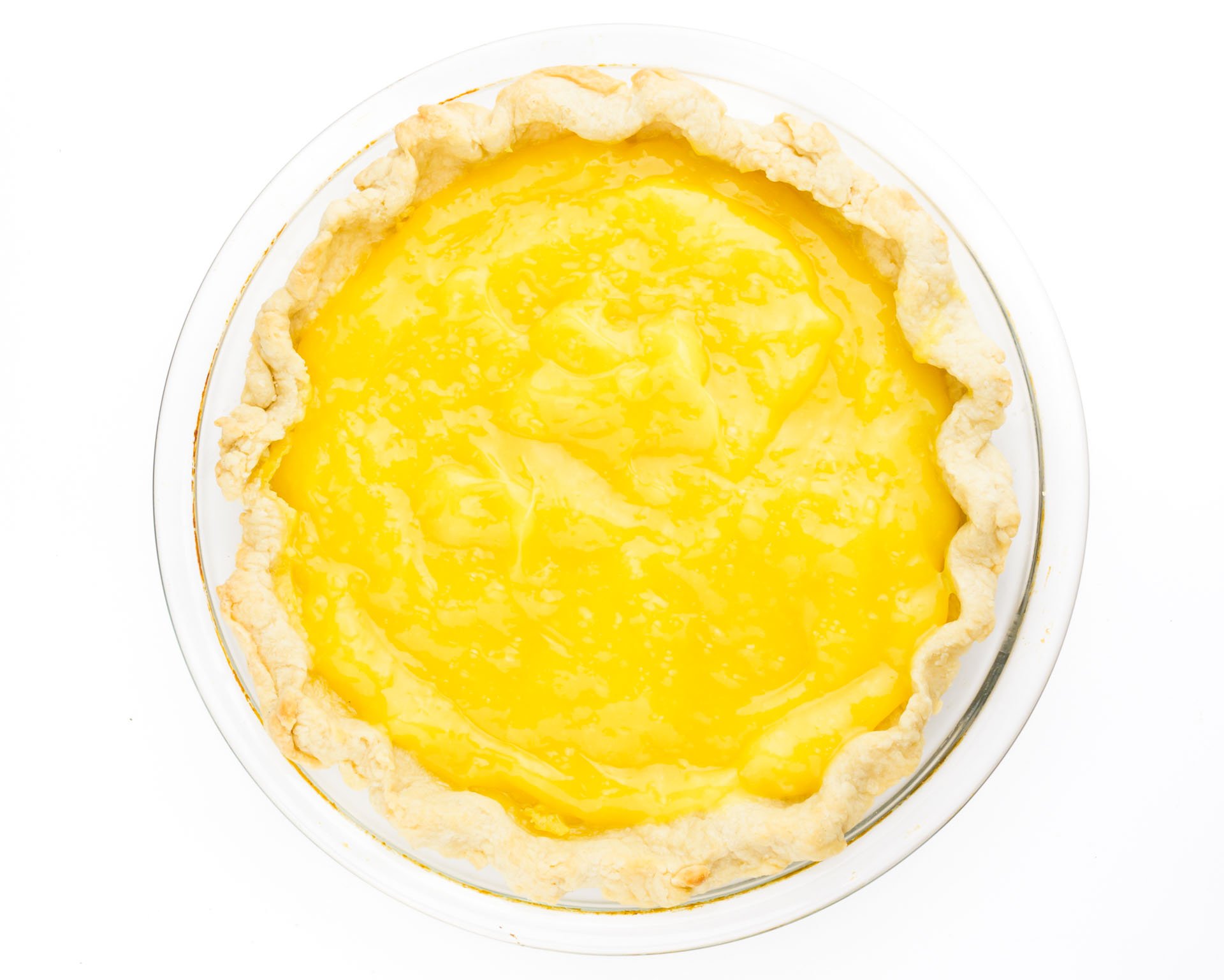 Lemon curd has been poured into a pie shell.
