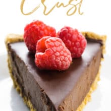 A slice of chocolate pie with raspberries on a top has this text above it: Oatmeal Crust.