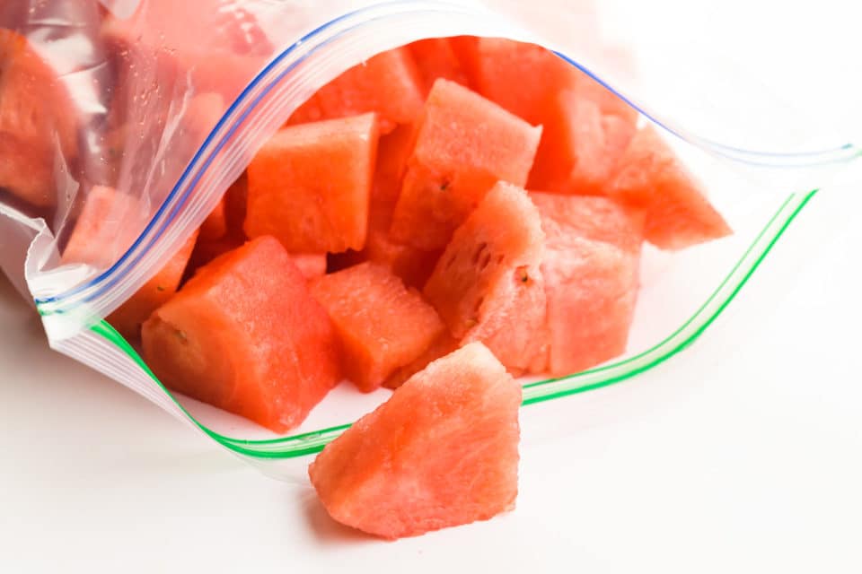 a ziplock freezer bag holds watermelon cubes.