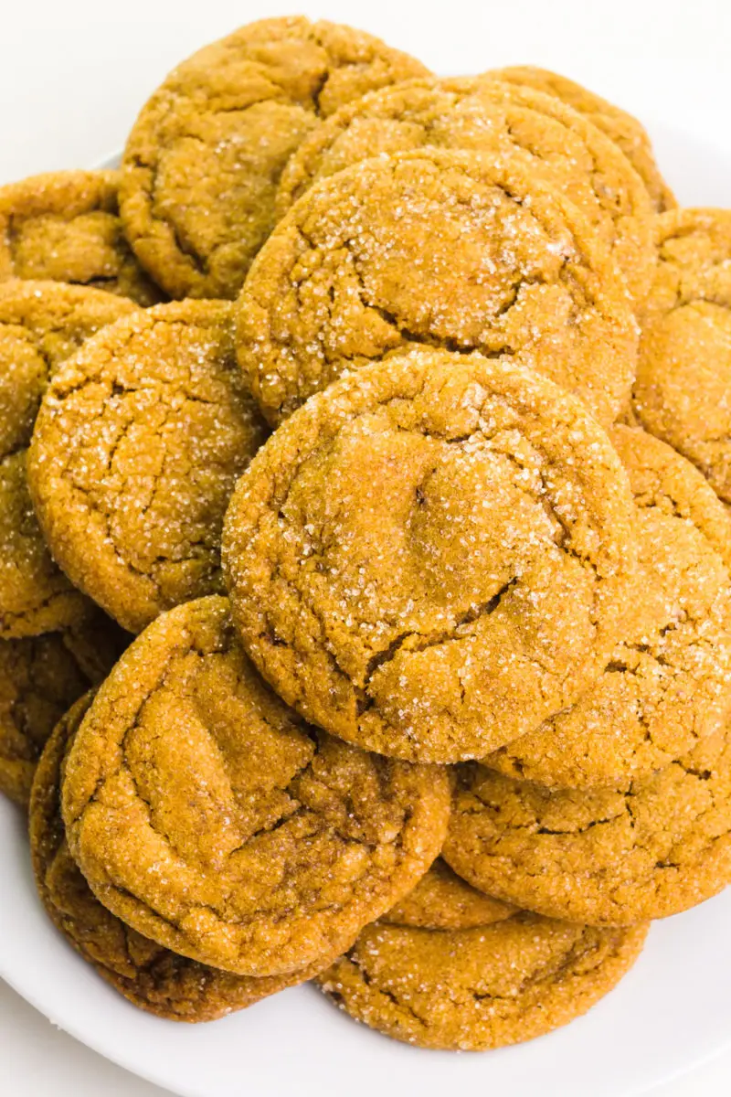 Looking down on a plate full of ginger cookies.