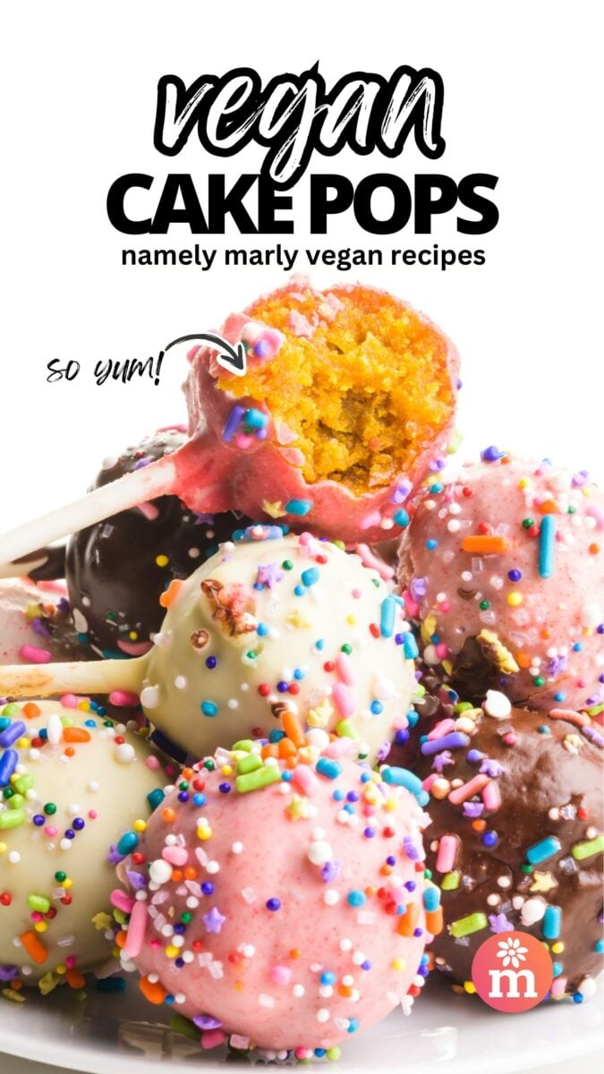 A stack of decorated cake pops shows the top one with a bite taken out. The text reads, Vegan Cake Pops, Namely Marly Vegan Recipes. An arrow points to the top cake bite and the text next to it reads, So Yum!