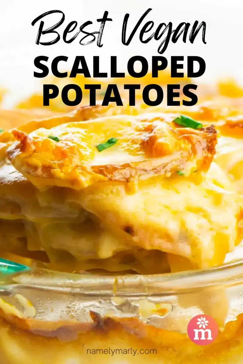 A spatula of cheesy potatoes hovers over a baking dish with more potatoes. The text reads, Best Vegan Scalloped Potatoes.