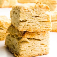 A stack of two rectangle biscuits sit in front of more biscuits.