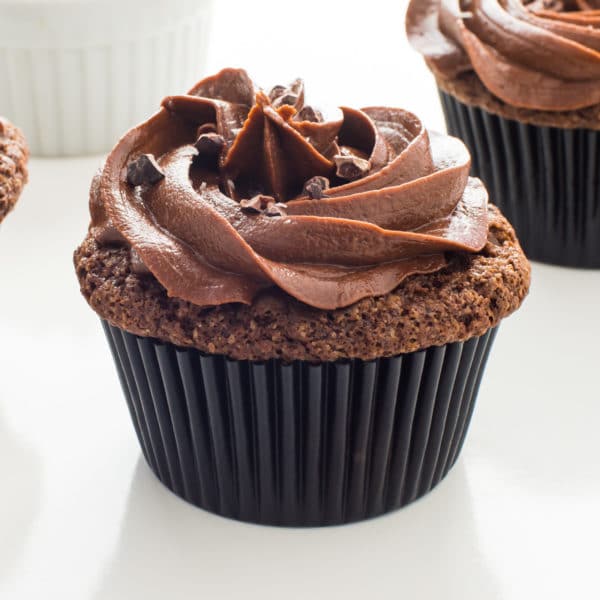 Closeup of a vegan chocolate stout cupcake with chocolate frosting