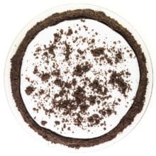 Looking down on a chocolate pie in an Oreo crust, with whipped cream on top and chocolate cookie crumbles.