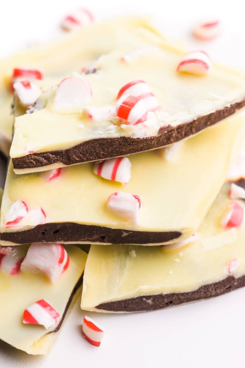 A stack of peppermint bark sits on a white counter.
