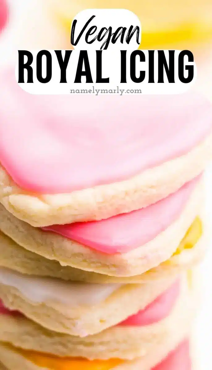 A stack of heart cookies with pink frosting has this text on top: Vegan Royal Icing.