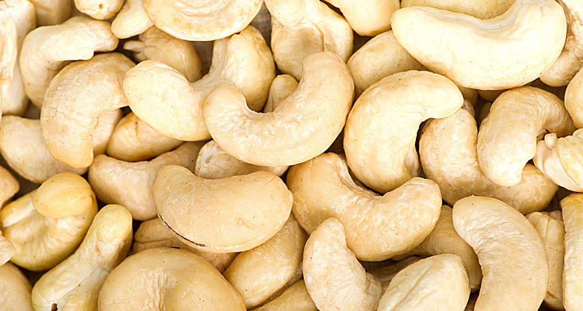 Looking down on a pile of raw cashews.