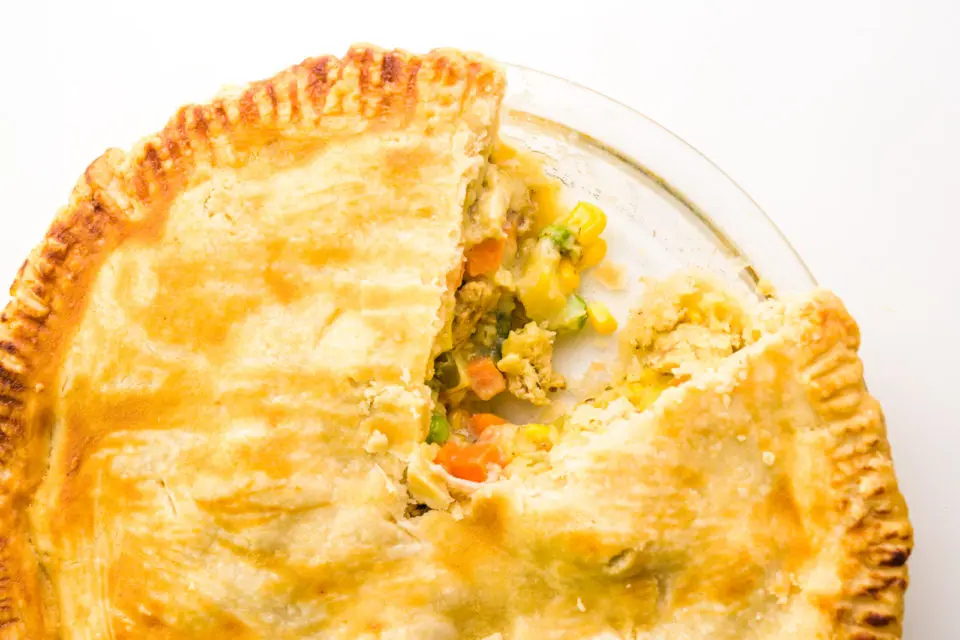 Looking down on a pot pie with a slice cut out of it.