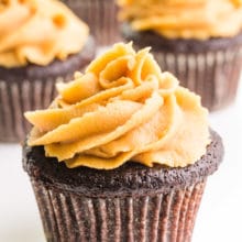 Chocolate cupcakes are topped with swirls of vegan peanut butter frosting.