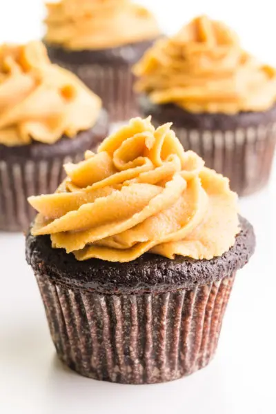 Chocolate cupcakes are topped with swirls of vegan peanut butter frosting.