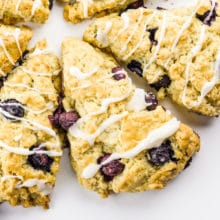 Several triangle shaped scones are pointing towards the center, create a round of scones.