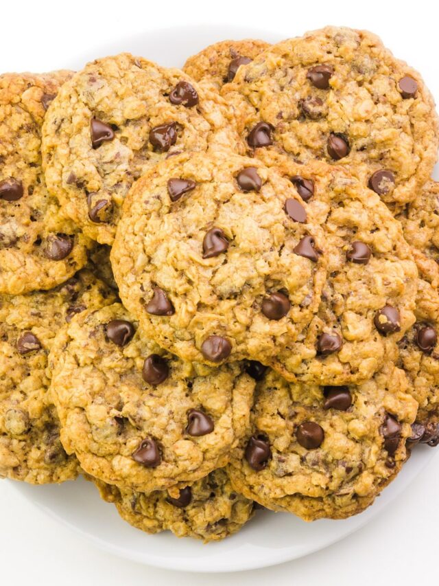 Looking down on a plate full of oatmeal chocolate chip cookies.