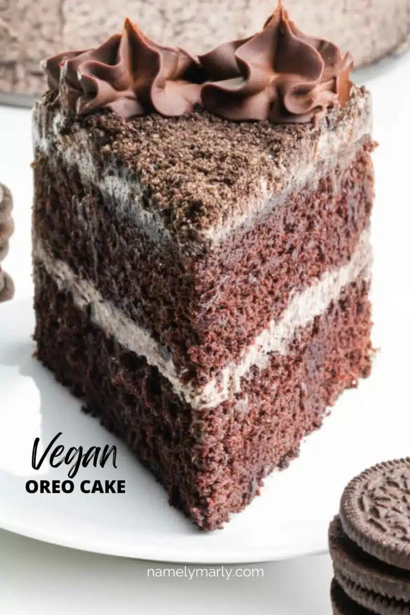 A slice of cake sits on a plate. The text reads, Vegan Oreo Cake.