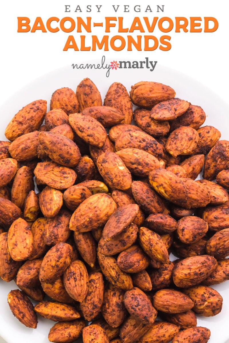 A plate full of seasoned almonds with text that reads Vegan Bacon-Flavored Almonds