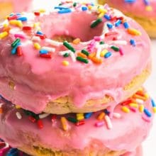 A stack of pink donuts with sprinkles has text at the top that reads, Vegan Gluten Free Donuts.