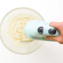 Vegan butter is being creamed with an electric mixer.